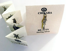 Load image into Gallery viewer, Packaging comes with accordian folded blurb enclosed, which shows the entire Chikara line.